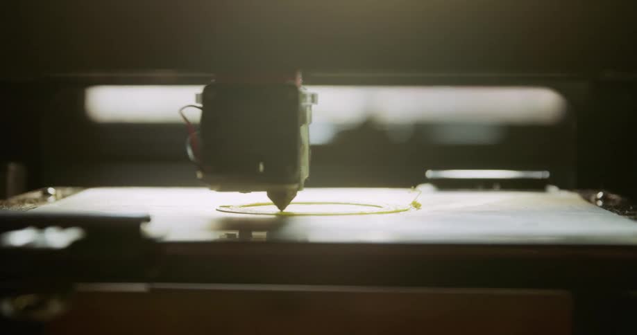 Robotic machinery etches onto a flat surface