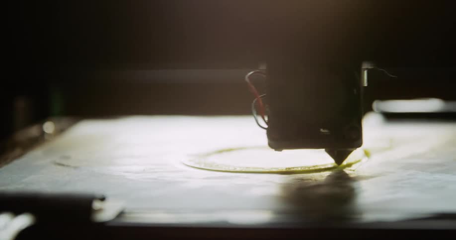 Machinery etches and traces a round circular object