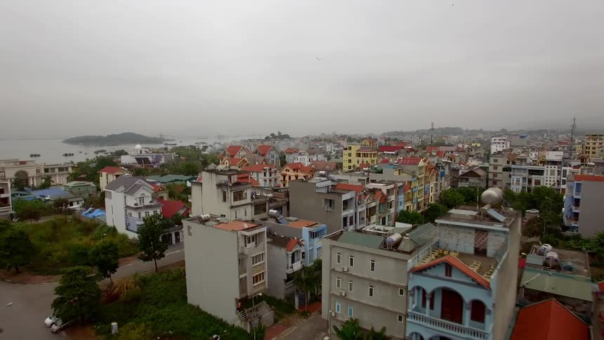 An aerial view of a 3rd world city is displayed