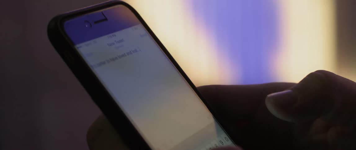 A person types on a smartphone