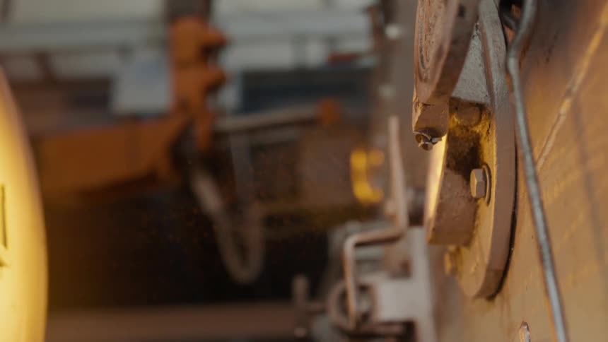 Machinery is displayed with dust coming out of it