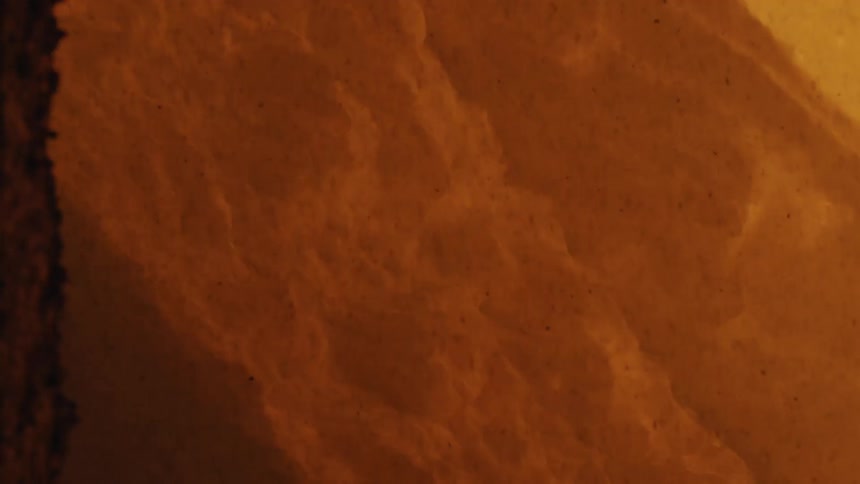 The volcano is erupting giving off steam and lava