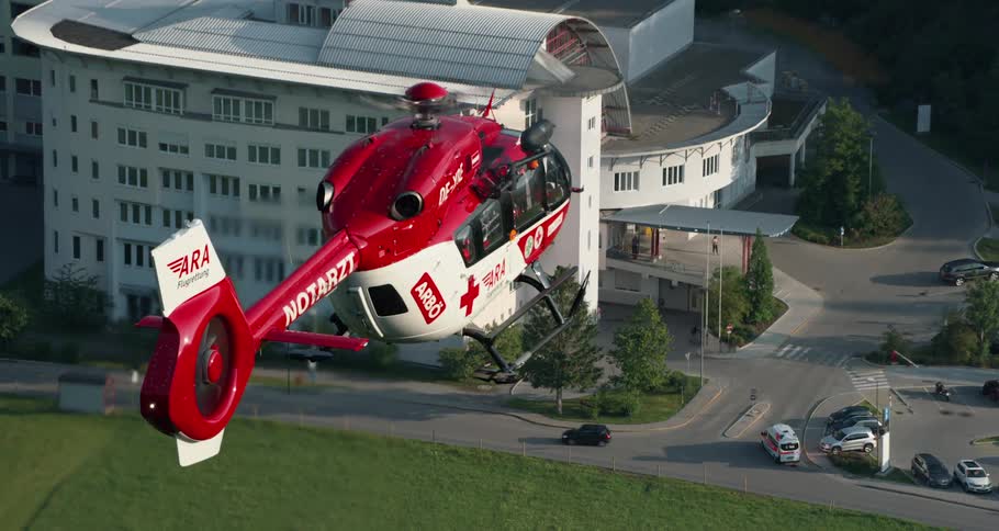 First aid helicopter approaching a hospital building