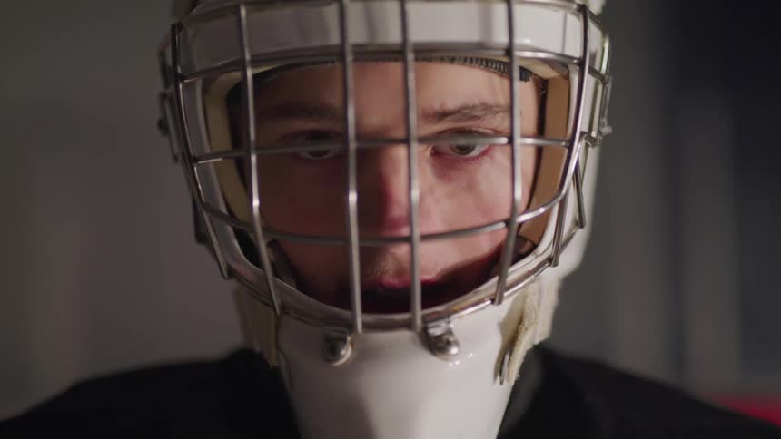 Close up of hockey goalie looking straight at camera