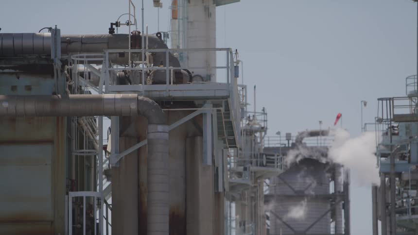 A truck drives past the plant