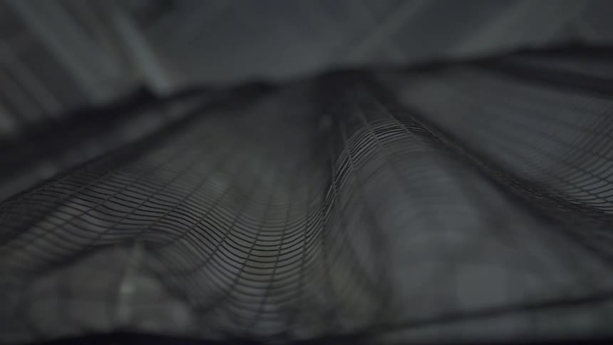 The net hangs from the ceiling in the building