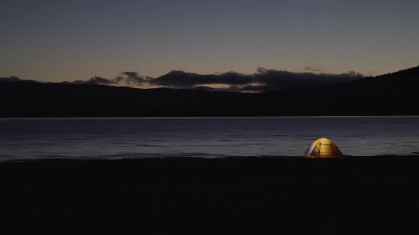 A tent in front of the water