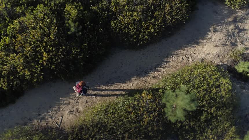 A person hiking on a dirt road