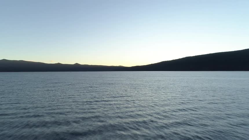 Aerial view of a calm lake at dusk