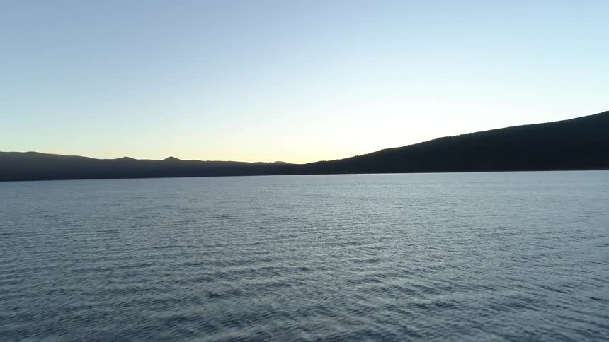 Aerial view of a calm lake at dusk