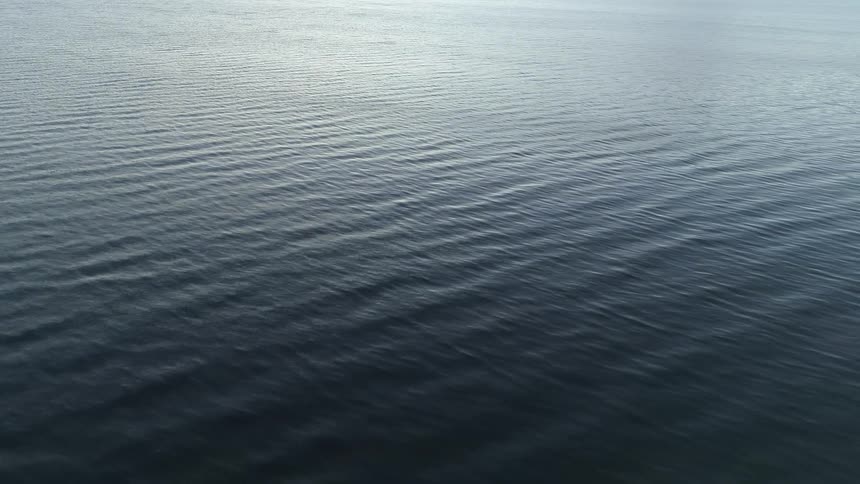 Aerial view of smooth and cal sea