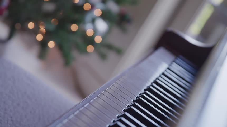 A piano and a christmas tree
