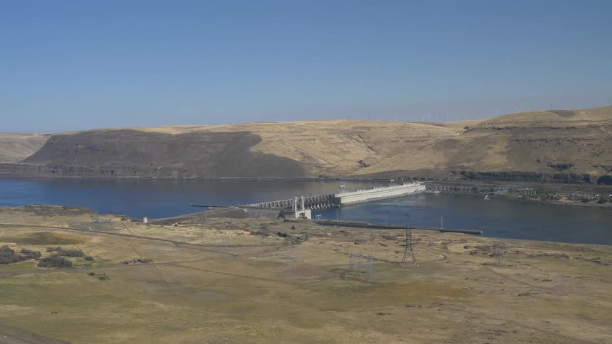 River sits between the sandy fields