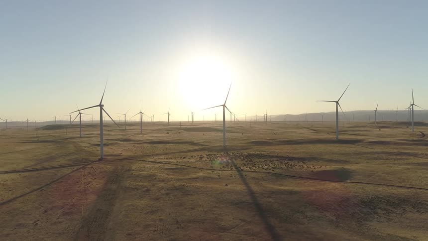 A wind farm full of turbines spread across the landscape