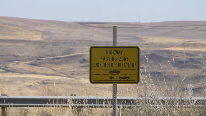 Large land area on the side of a highway sign