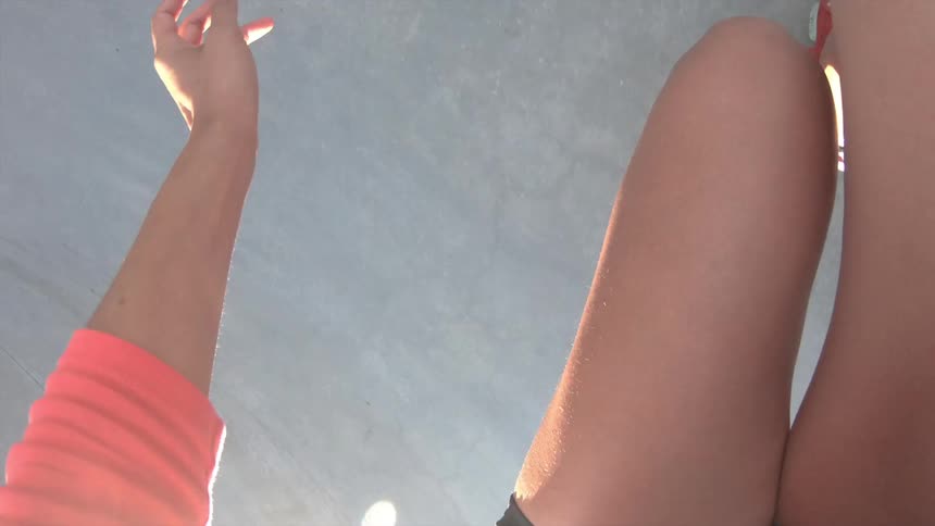 A woman skating on roller skates in a skate park