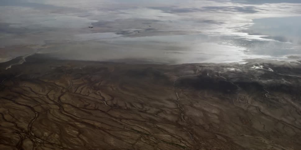 Photographers In Airplane Over African Wetlands