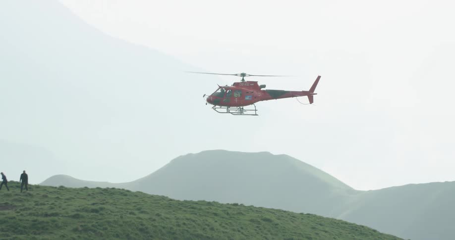 The helicopter drops off two people
