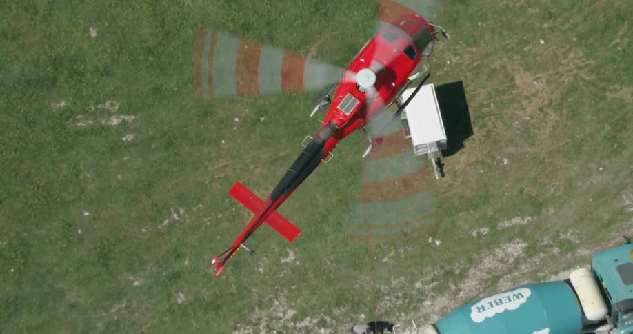An aerial view of a helicopter flying down is displayed