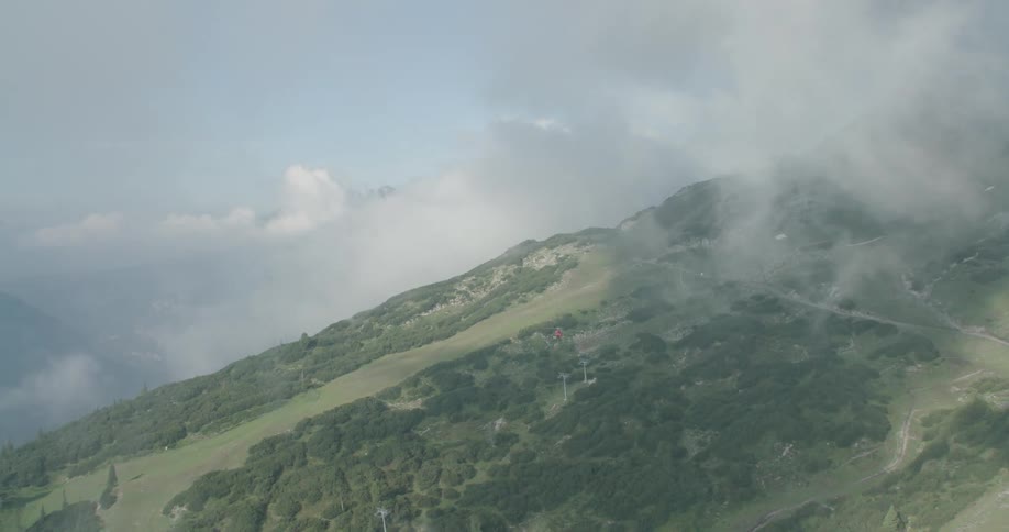 Search and rescue helicopter flies over the mountains