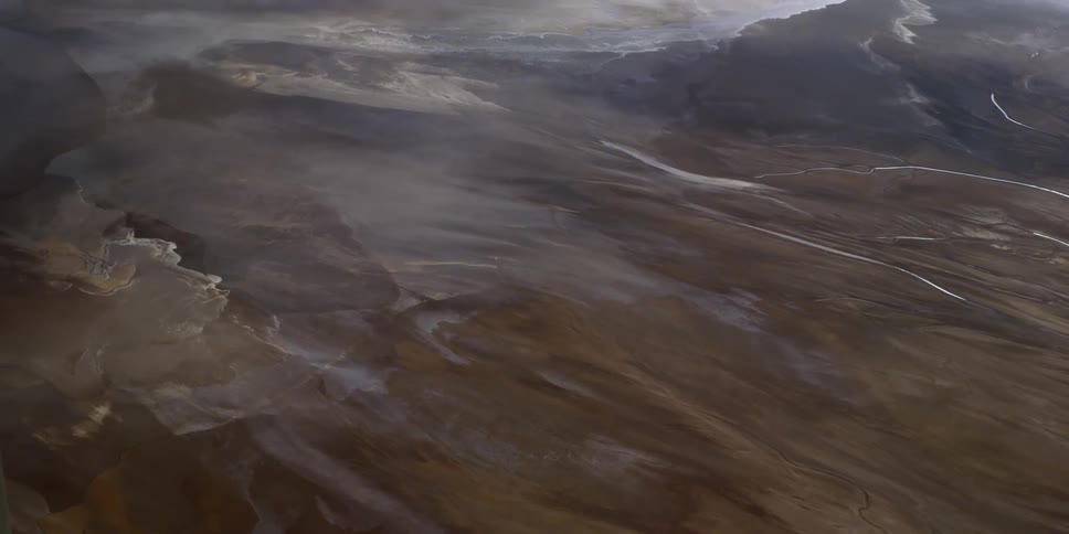 Aerial view of fog moving across a landmass