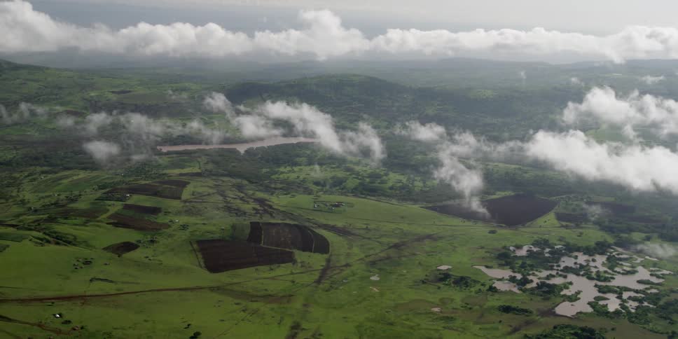 Photographers In Airplane Over African Wetlands