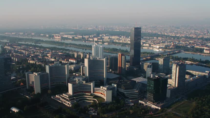 Tall buildings are by the river