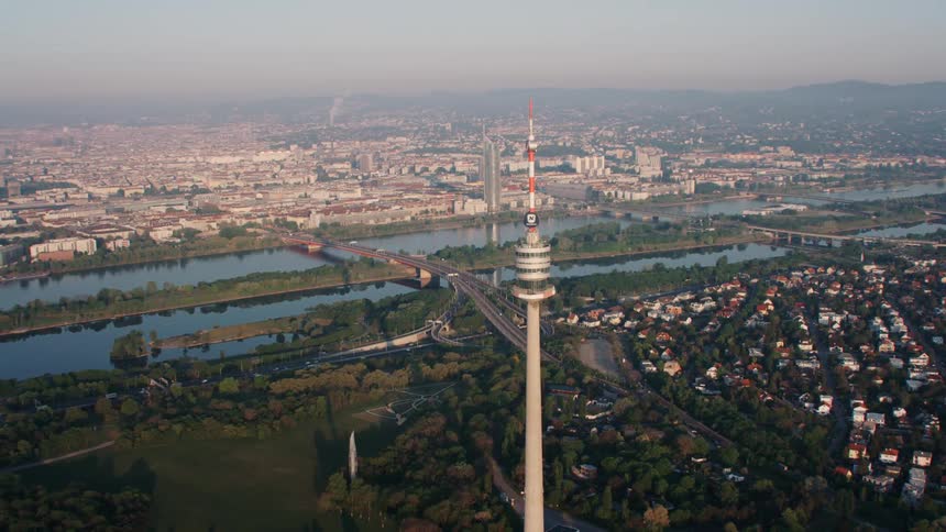 Landscape view with a large tower a river and a city skyline