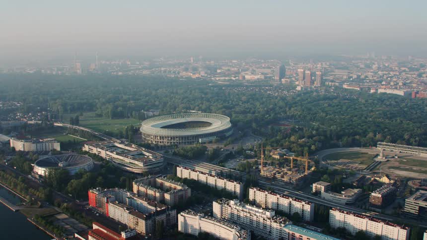 A sports arena in a city surrounded by buildings
