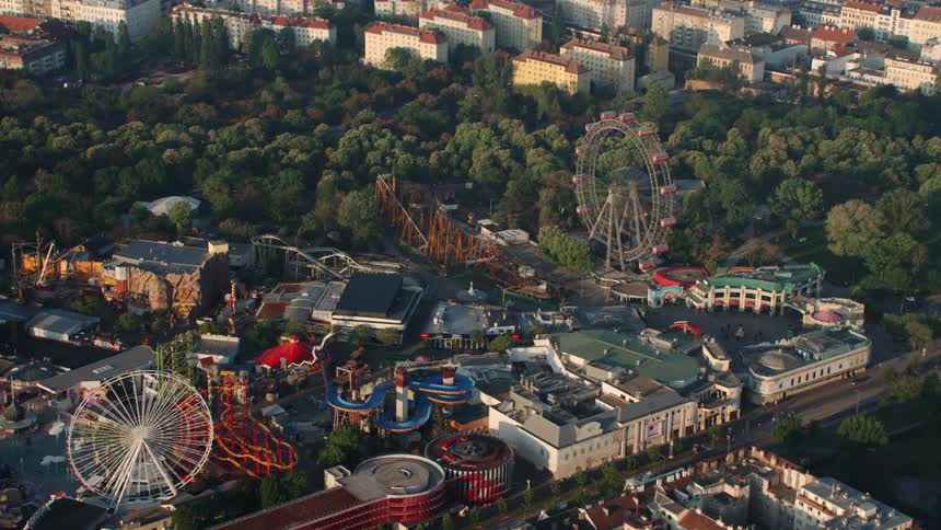 The amusement park is beside the city