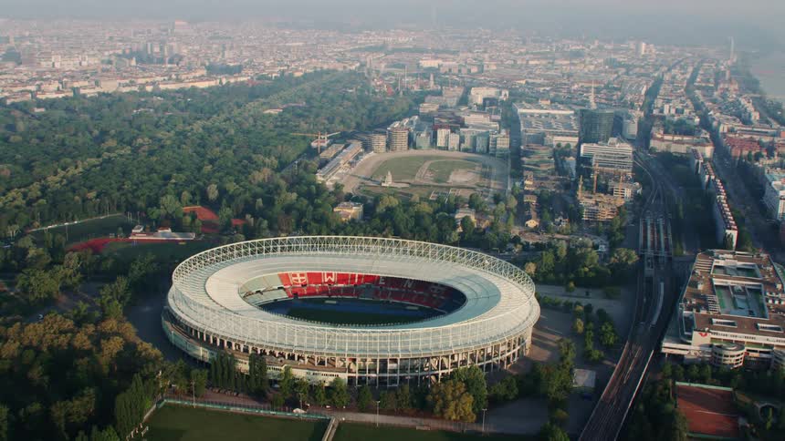 An aerial view of a sports stadium in a city