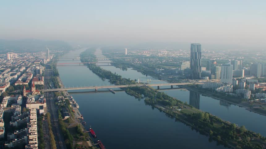 A pair of bridges spanning a pair of parallel rivers dividing a metropolis