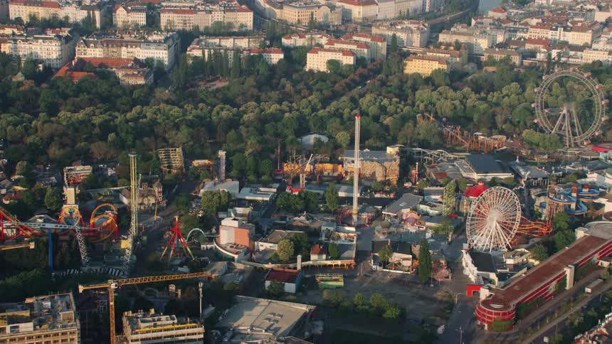 An amusement park with roller coasters and ferris wheels