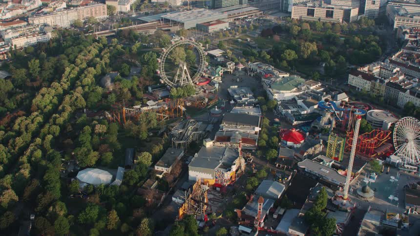 An amusement park with ferris wheels and roller coasters