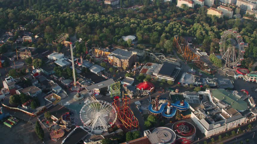 An aerial view of an amusement park on a summer day