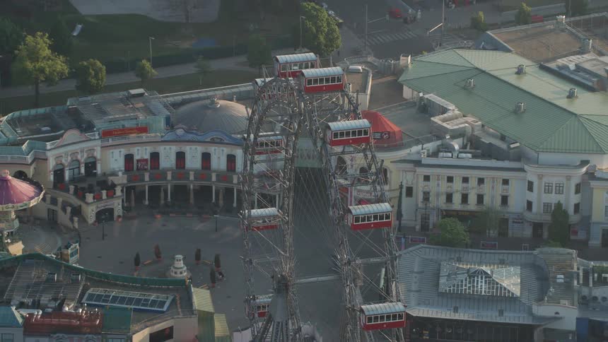 The ferris wheel is in the middle of the city