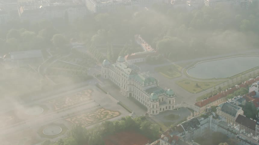 A large building with decorative landscape in a city
