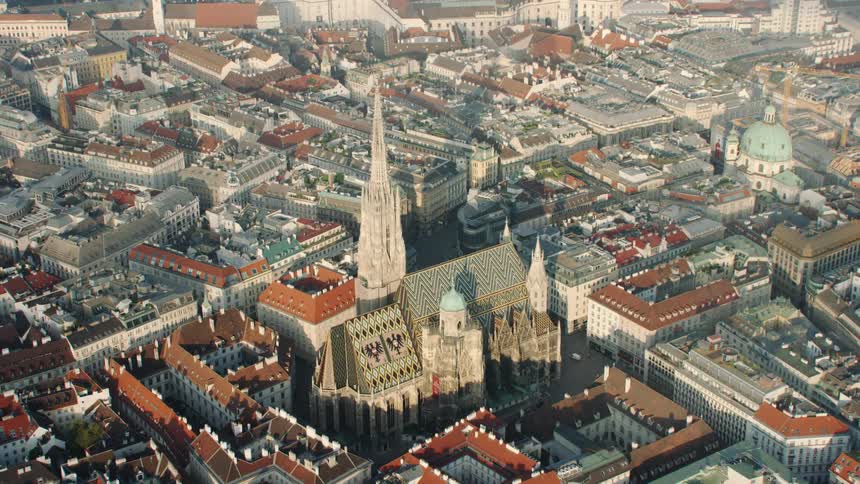 A church in the middle of buildings on a city street