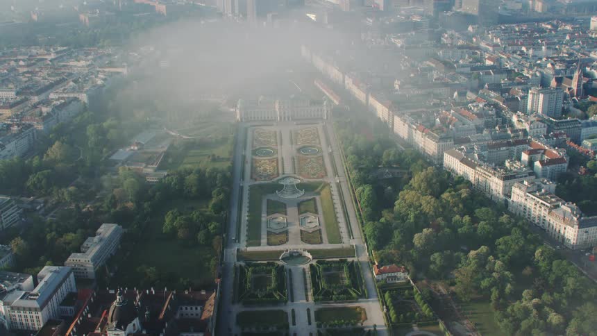 An aerial view of city parks and buildings on a summer day