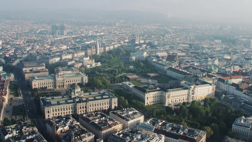 Horizontal aerial view over the rooftops of the buildings in vienna