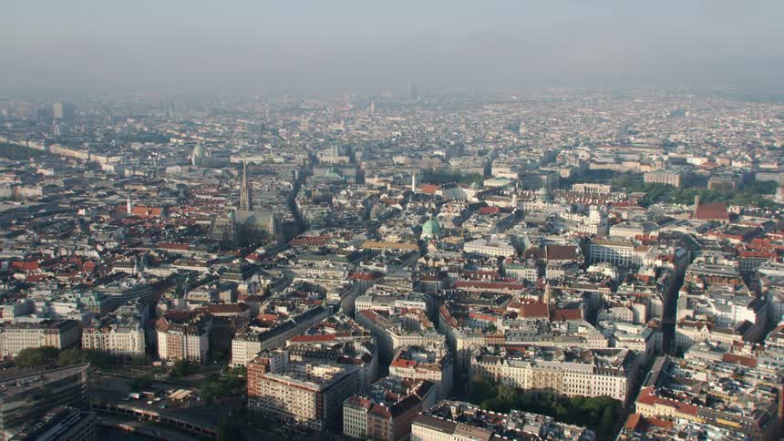 Aerial view of apartment buildings in large city under heavy fog