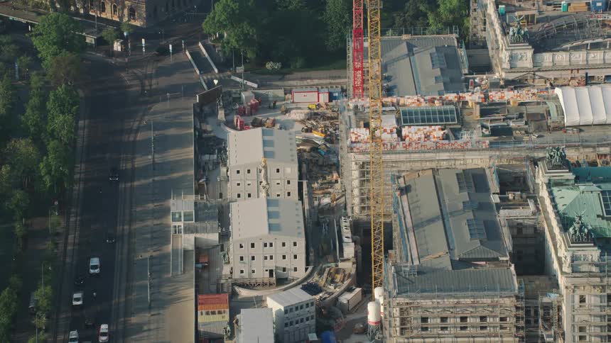 The cars travel past the intersection in the city