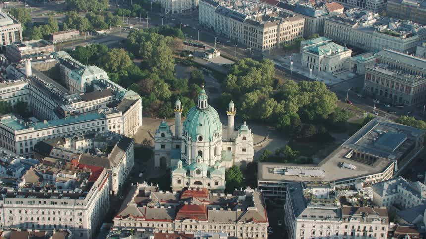 A church surrounded by buildings and trees