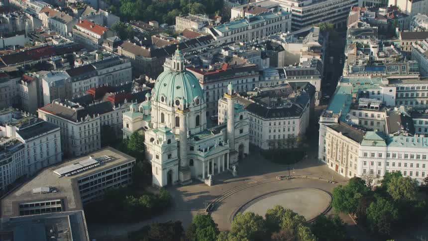 An aerial view of a downtown city is displayed