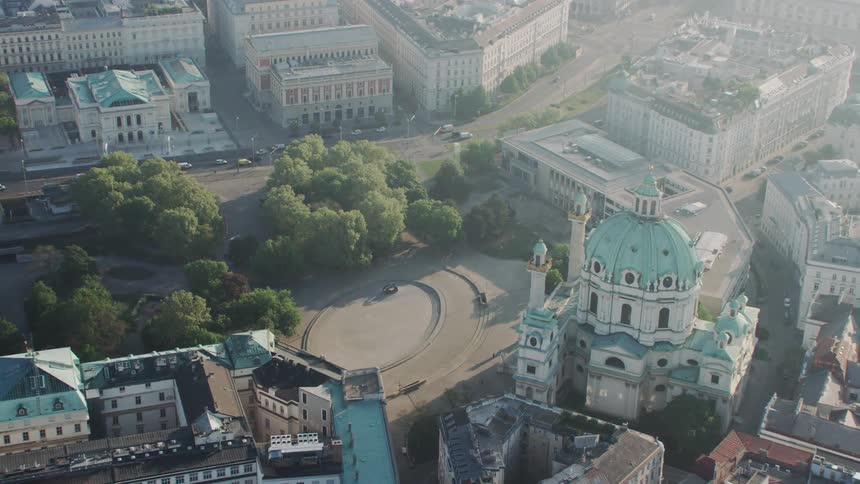 An aerial view of city buildings on a sunny day