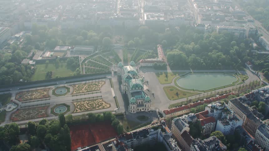 A large building with a decorative landscape in a city