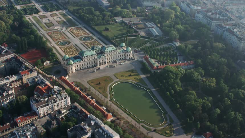 The city park lines the buildings