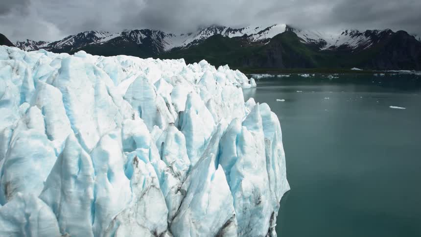 Ice glaciers with mountains and the sky in the background