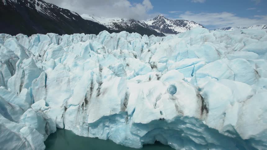A cracked glacier meets the sea
