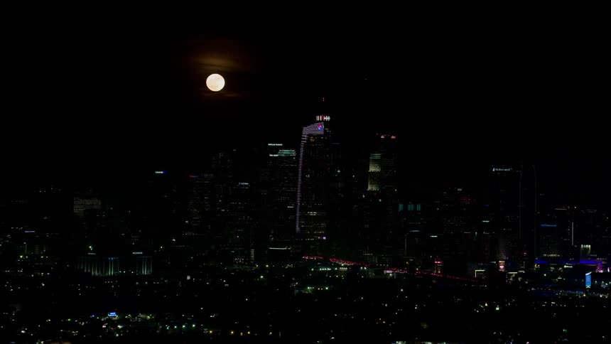 The moon over the city at night